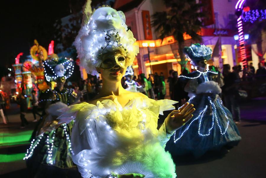 People perform during a Halloween parade at the Happy Valley amusement park in east China's Shanghai, Oct. 10, 2015.